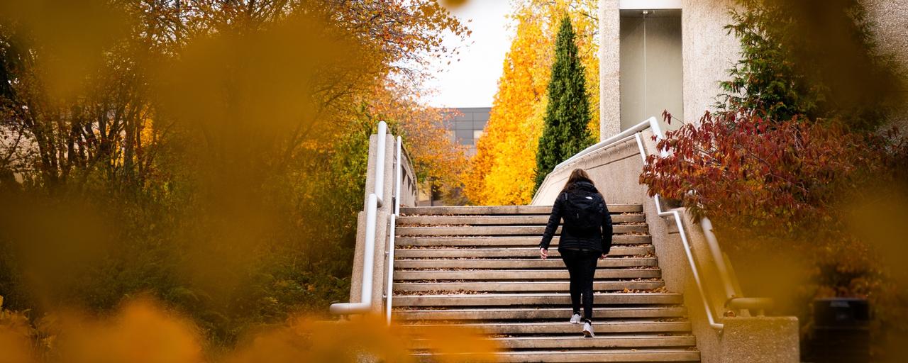 Student Walking up Exterior Stairs on Allendale Campus